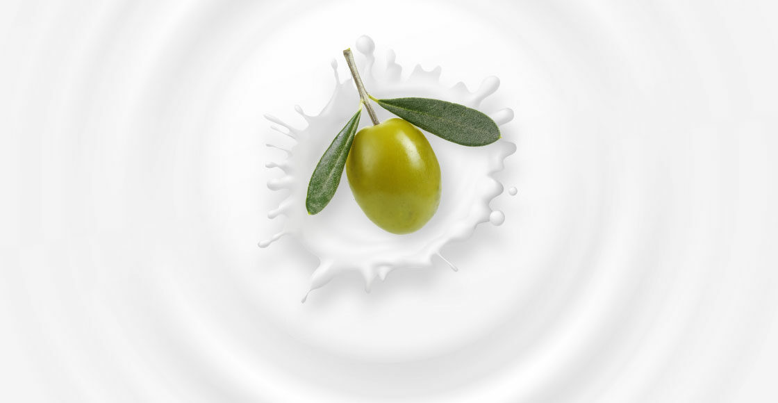 Olive falling in milk